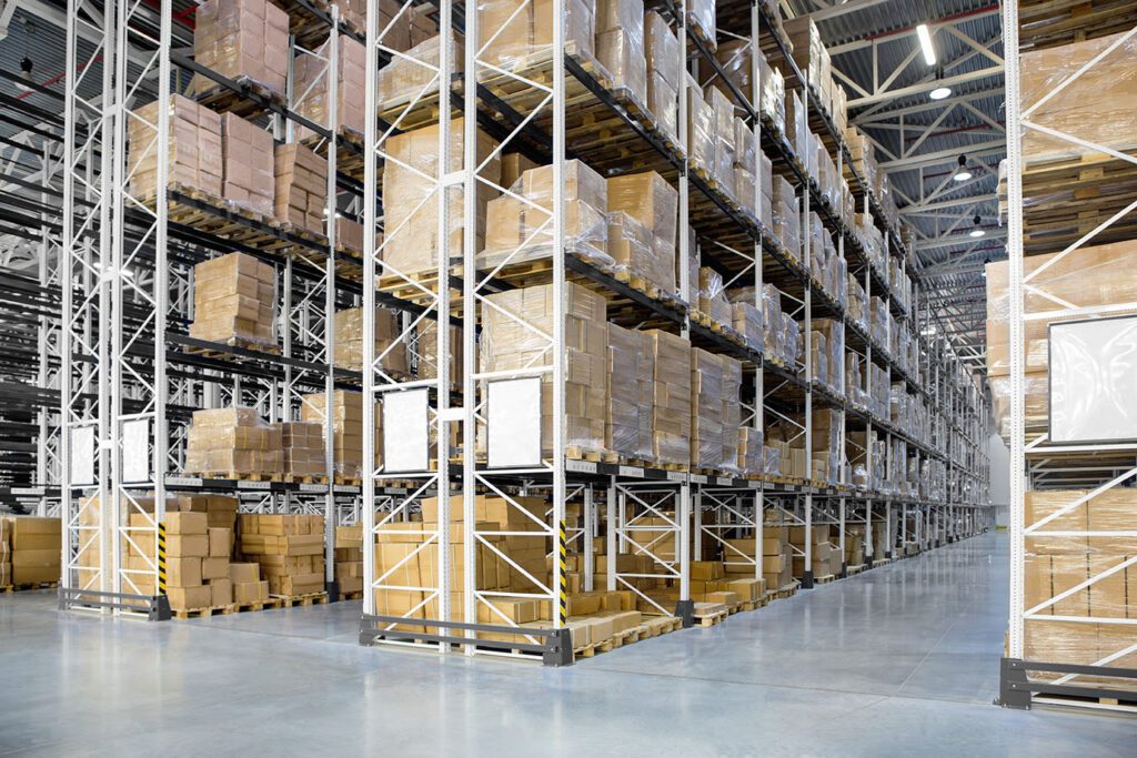 Huge distribution warehouse with boxes on high shelves