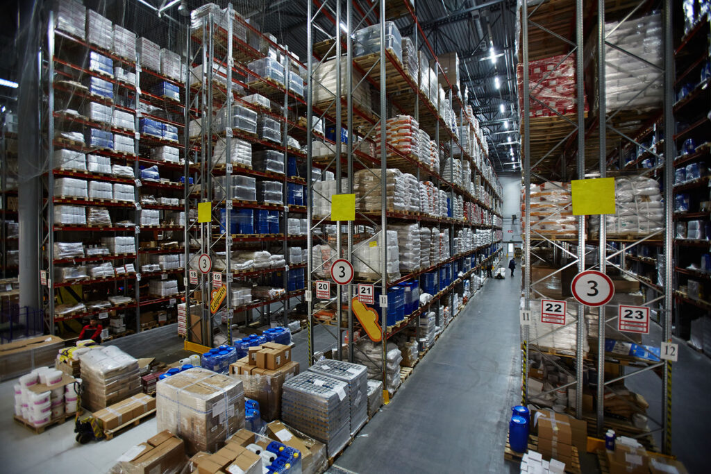 Modern warehouse with lots of packed goods on shelves